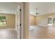 View of living room and bedroom featuring light wood-look floors and neutral walls at 4443 Robin Hood W Trl, Sarasota, FL 34232