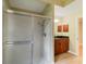 Bathroom featuring glass enclosed shower, vanity with granite countertops and views to another room at 4443 Robin Hood W Trl, Sarasota, FL 34232