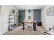 Stylish home office with modern desk, shelving, a comfortable chair, and a large window for natural light at 4509 Dusky Dawn Ln, Palmetto, FL 34221