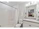 Clean bathroom featuring shower-tub combo, white vanity, and functional mirror at 4664 Hegira St, North Port, FL 34286
