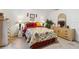 Comfortable bedroom with side tables with lamps, ceiling fan, and plenty of storage space at 4664 Hegira St, North Port, FL 34286