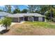 Charming single-Gathering home features a well-manicured lawn, and two-car garage at 4664 Hegira St, North Port, FL 34286