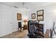 Inviting home office space with neutral colors, ceiling fan, comfortable furniture and tasteful decor at 4664 Hegira St, North Port, FL 34286