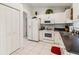 Functional kitchen with white cabinets, modern appliances, and ample storage space, creating an organized cooking environment at 4664 Hegira St, North Port, FL 34286