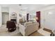 Cozy living room featuring comfortable seating, neutral décor, and natural light from a large window at 4664 Hegira St, North Port, FL 34286
