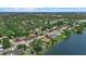 Breathtaking aerial view of homes nestled near a large, shimmering lake, offering serene lakeside living at 4708 26Th W Ave, Bradenton, FL 34209