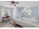 Sunlit bedroom with a desk, closet, and a comfortable bed under a vaulted ceiling at 4708 26Th W Ave, Bradenton, FL 34209
