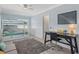 Bright bedroom featuring a bunk bed, study desk, and modern decor at 4708 26Th W Ave, Bradenton, FL 34209