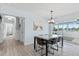 Charming dining room with tile floors and sliding glass doors to the porch at 4708 26Th W Ave, Bradenton, FL 34209