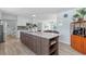 Open kitchen featuring a large center island with a marble countertop at 4708 26Th W Ave, Bradenton, FL 34209