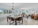 Open living room featuring a dining area, comfortable furniture, and water view at 4708 26Th W Ave, Bradenton, FL 34209