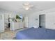 Bright bedroom featuring an ensuite, a walk in closet and a tv at 4708 26Th W Ave, Bradenton, FL 34209