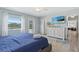 Lovely bedroom featuring an ensuite, outdoor access, and views of the lake at 4708 26Th W Ave, Bradenton, FL 34209