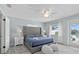 Comfortable bedroom with a tufted headboard, ensuite bathroom, and a view of the pool at 4708 26Th W Ave, Bradenton, FL 34209