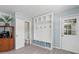 Mudroom with built-in storage bench, shelving and a side entrance to the exterior at 4708 26Th W Ave, Bradenton, FL 34209