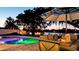 Inviting outdoor space with a pool and fire pit at sunset at 4708 26Th W Ave, Bradenton, FL 34209
