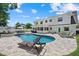 Inviting pool and backyard with lounge chairs at 4708 26Th W Ave, Bradenton, FL 34209