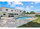 Backyard view featuring a pool and the home's exterior at 4708 26Th W Ave, Bradenton, FL 34209