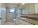 Bathroom with a spacious vanity, shower, modern tile, and neutral colors at 4873 Huntleigh Dr, Sarasota, FL 34233