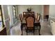 Cozy dining room featuring a wood table with upholstered chairs, ideal for Gathering meals at 4873 Huntleigh Dr, Sarasota, FL 34233
