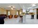 Spacious kitchen and living area featuring tile floors, updated appliances, and lots of natural light at 4873 Huntleigh Dr, Sarasota, FL 34233