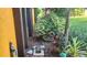 Beautiful exterior with lush landscaping and a yellow facade at 4873 Huntleigh Dr, Sarasota, FL 34233