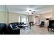 This elegant living room boasts hard surface flooring, plenty of natural light, and a ceiling fan at 4873 Huntleigh Dr, Sarasota, FL 34233