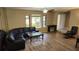 Inviting living room featuring lots of natural light, ceiling fan, and a lovely view to the exterior at 4873 Huntleigh Dr, Sarasota, FL 34233