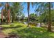 Beautiful backyard view, with trees and a pond at 5168 Northridge Rd # 106, Sarasota, FL 34238