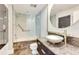 Modern bathroom features a glass shower, floating vanity, and a unique vessel sink at 5168 Northridge Rd # 106, Sarasota, FL 34238