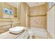 Cozy bathroom features decorative tile details, granite countertops, and updated fixtures at 5168 Northridge Rd # 106, Sarasota, FL 34238