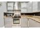Well-equipped kitchen features granite countertops, stainless steel appliances, and sleek gray cabinetry at 5168 Northridge Rd # 106, Sarasota, FL 34238