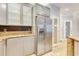 Kitchen featuring stainless steel appliances, ample counter space, and modern cabinets with glass doors at 5168 Northridge Rd # 106, Sarasota, FL 34238