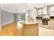 Modern kitchen featuring stainless steel appliances and a seamless flow to the living area at 5168 Northridge Rd # 106, Sarasota, FL 34238