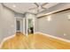 Empty main bedroom featuring hardwood floors, ceiling fan, and access to an en-suite bathroom at 5168 Northridge Rd # 106, Sarasota, FL 34238