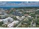 Wide aerial view of city showcasing the various buildings, streets, and the expansive greenery at 525 N Orange Ave # 202, Sarasota, FL 34236