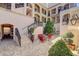 Picturesque courtyard featuring brick pavers, iron railings, cozy seating, and lush landscaping for a serene outdoor experience at 525 N Orange Ave # 202, Sarasota, FL 34236