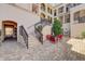 Beautiful courtyard with brick pavers, wrought iron railings, seating, and lush landscaping create a relaxing outdoor space at 525 N Orange Ave # 202, Sarasota, FL 34236