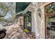 Charming storefront featuring a green awning, decorative signage, and sidewalk seating at 525 N Orange Ave # 202, Sarasota, FL 34236