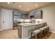 Modern kitchen featuring gray cabinetry, stainless steel appliances, granite countertops, and a breakfast bar at 525 N Orange Ave # 202, Sarasota, FL 34236