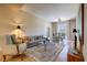 Inviting living room features neutral tones, stylish furniture, and a view of a dining area with natural light at 525 N Orange Ave # 202, Sarasota, FL 34236