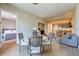 A dining space blending seamlessly with the living area, bedroom, and kitchen, maximizing space and functionality at 525 N Orange Ave # 202, Sarasota, FL 34236