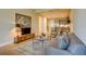Open concept living room, seamlessly integrates the kitchen with a comfortable sitting area and view to kitchen at 525 N Orange Ave # 202, Sarasota, FL 34236