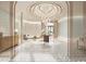 Elegant residence lobby with marble floors, contemporary lighting, and stylish decor at 555 Quay Cmn # 1005, Sarasota, FL 34236