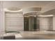 Luxury spa area featuring soaking tubs, a rain shower, and serene ambient lighting at 555 Quay Cmn # 1005, Sarasota, FL 34236