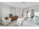 Comfortable bedroom featuring an accent wall, modern furniture, and a serene atmosphere at 5770 Long Shore Loop, Sarasota, FL 34238