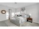 Modern bedroom with neutral decor, stylish lamps, and comfortable king size bed at 5770 Long Shore Loop, Sarasota, FL 34238