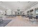 Expansive clubhouse with abundant seating, stylish decor, and natural light through many windows at 5770 Long Shore Loop, Sarasota, FL 34238