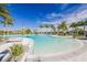 Resort-style zero entry community pool with sun loungers, tropical landscaping, and clear blue water for relaxing afternoons at 5770 Long Shore Loop, Sarasota, FL 34238
