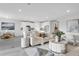 Modern living room with tile floors, an open-concept layout, and stylish decor at 5770 Long Shore Loop, Sarasota, FL 34238
